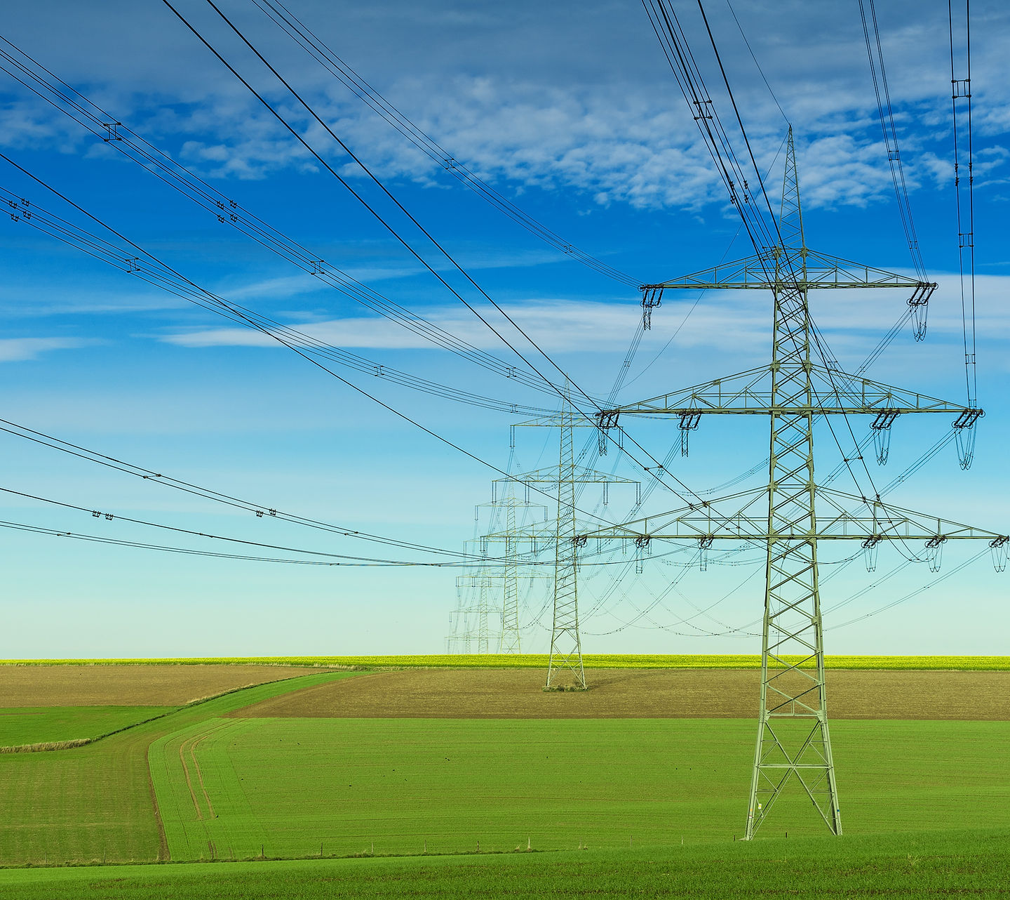 gray-electric-post-white-blue-cloudy-sky.jpg